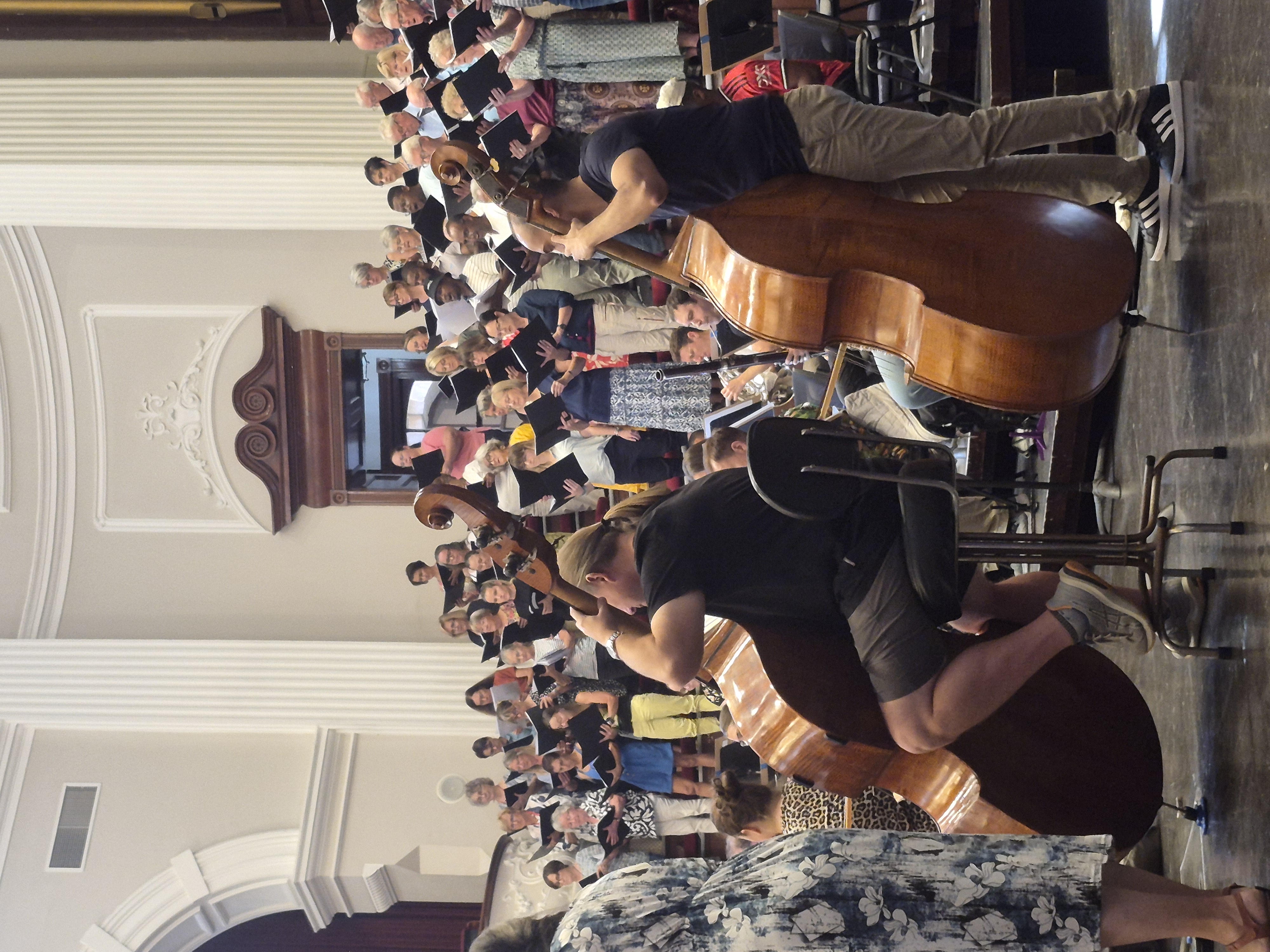 Choir rehearsal with cellist
